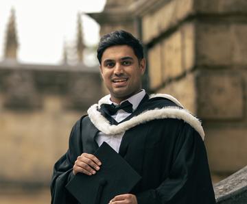 HMC student Hamza in academic gown