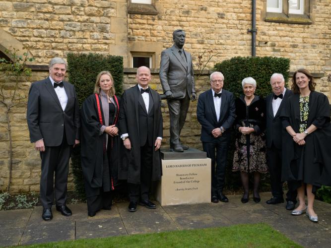 Photo of Lord Smith and Lord Hague with others in front of statue of Lord Harris