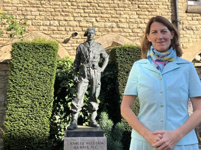 Beth Breeze by the statue of Charles William Harris MC