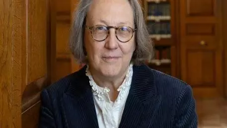 Professor Jane Shaw in a wood-panelled room