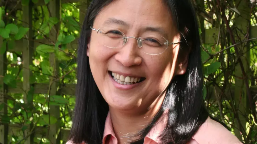 Portrait of Prof Bee Wee (woman in pink shirt with glasses)