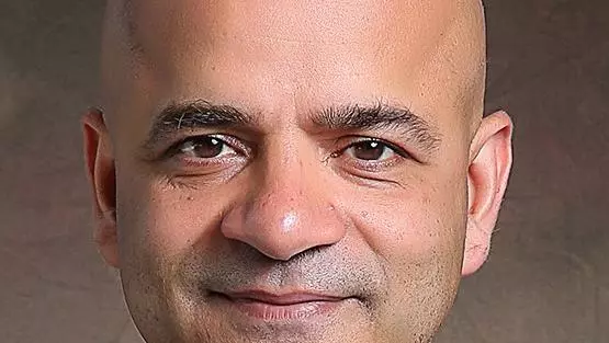 Headshot of a man in a suit