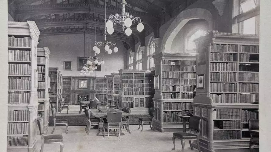 A long shot down the Library taken in the 1890s with furniture and bookcase in place