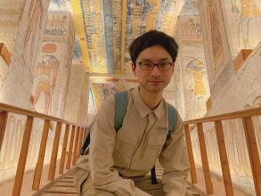 Dr Jordan Miller crouching in the tomb of Ramesses VI, Valley of the Kings, Luxor, Egypt.