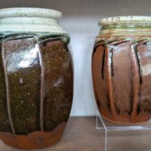 Two jars with brown glaze, same shape but different sizes