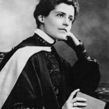 Black and white photograph of a female.  Head and shoulders. 
