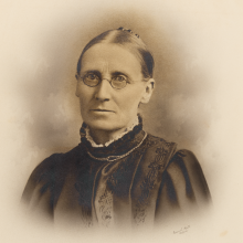 Black and white photograph of a female.  Head and shoulders. 
