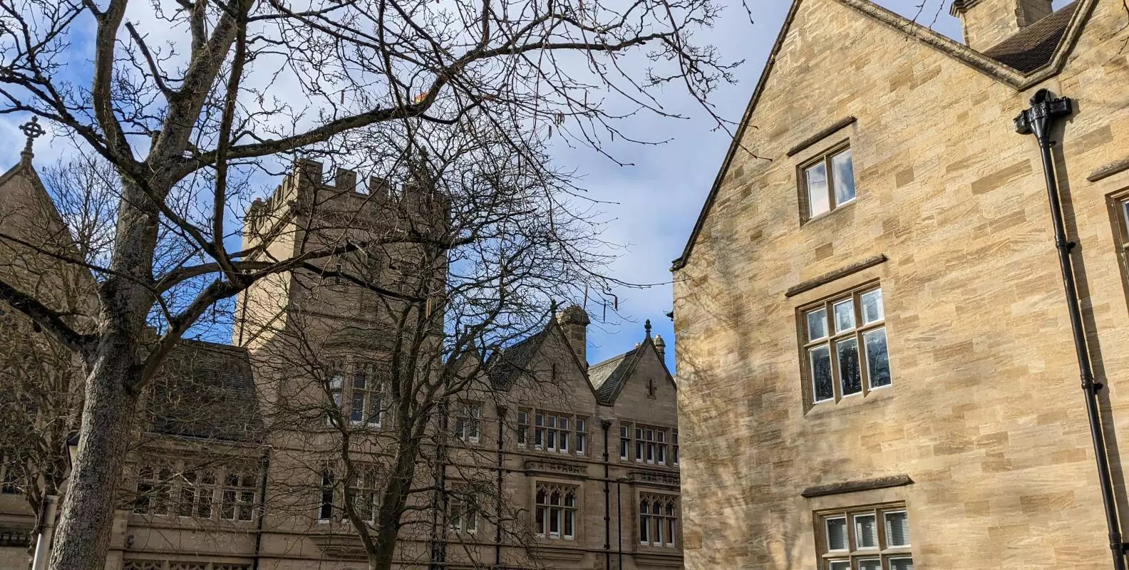 Two buildings shown opposite one another.
