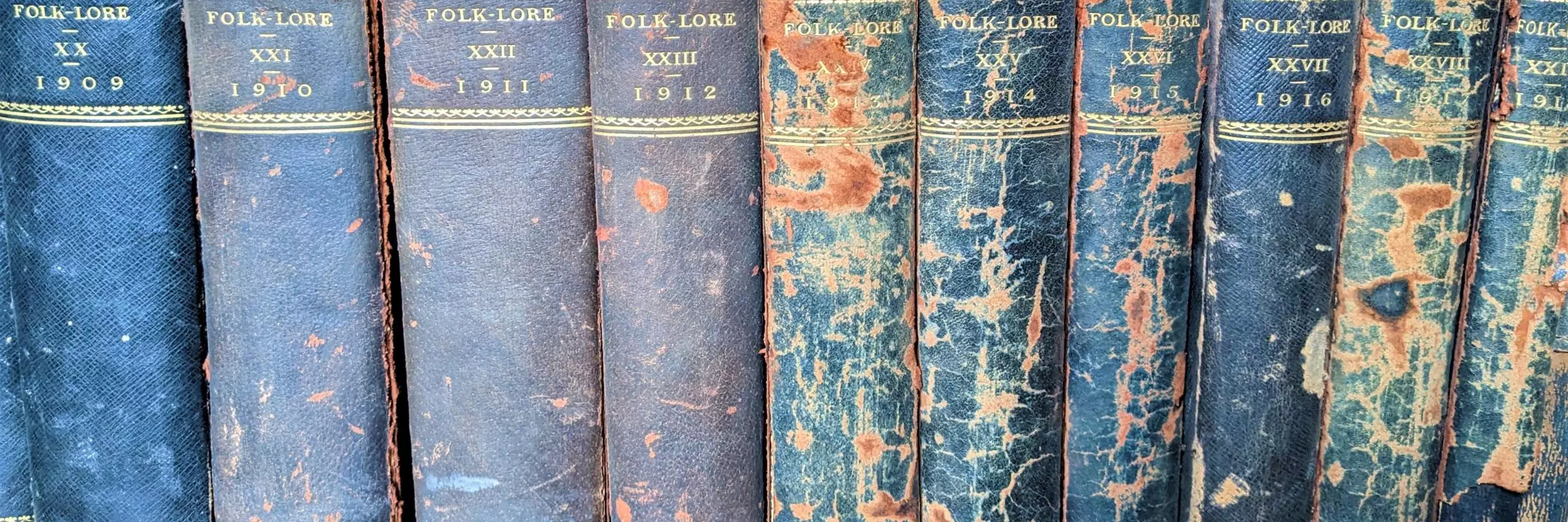 A photograph of a set of journals bearing the name Folklore dating from 1910s