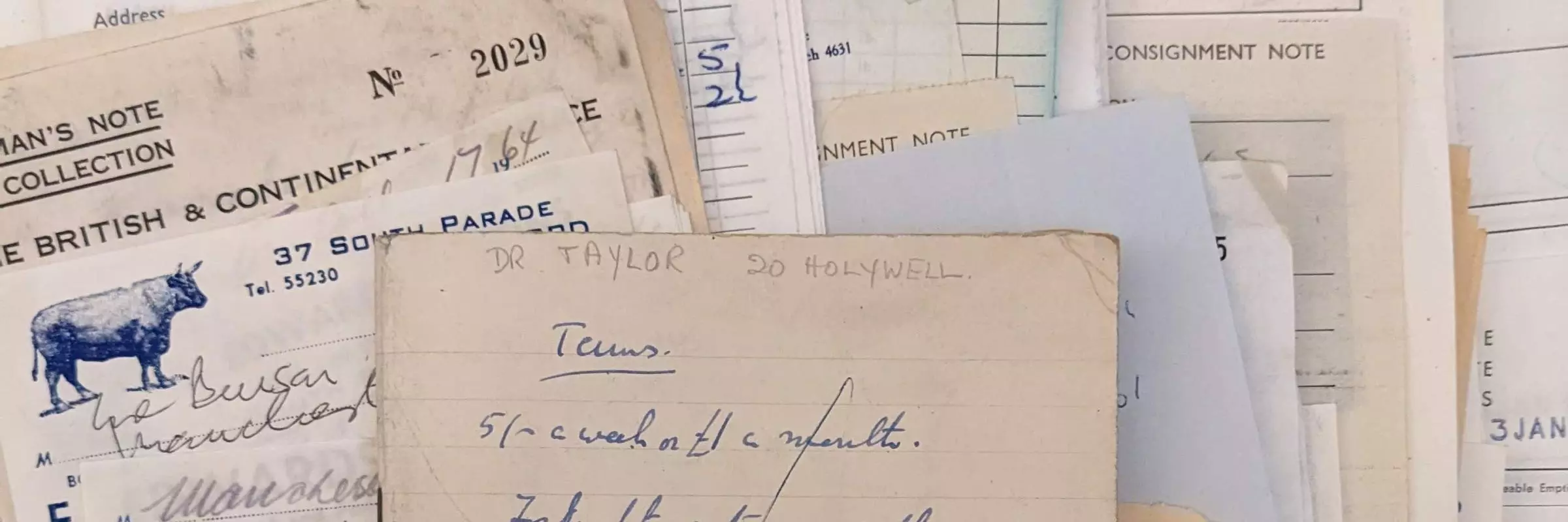 Photograph of a pile of bills relating to food from the 1960s