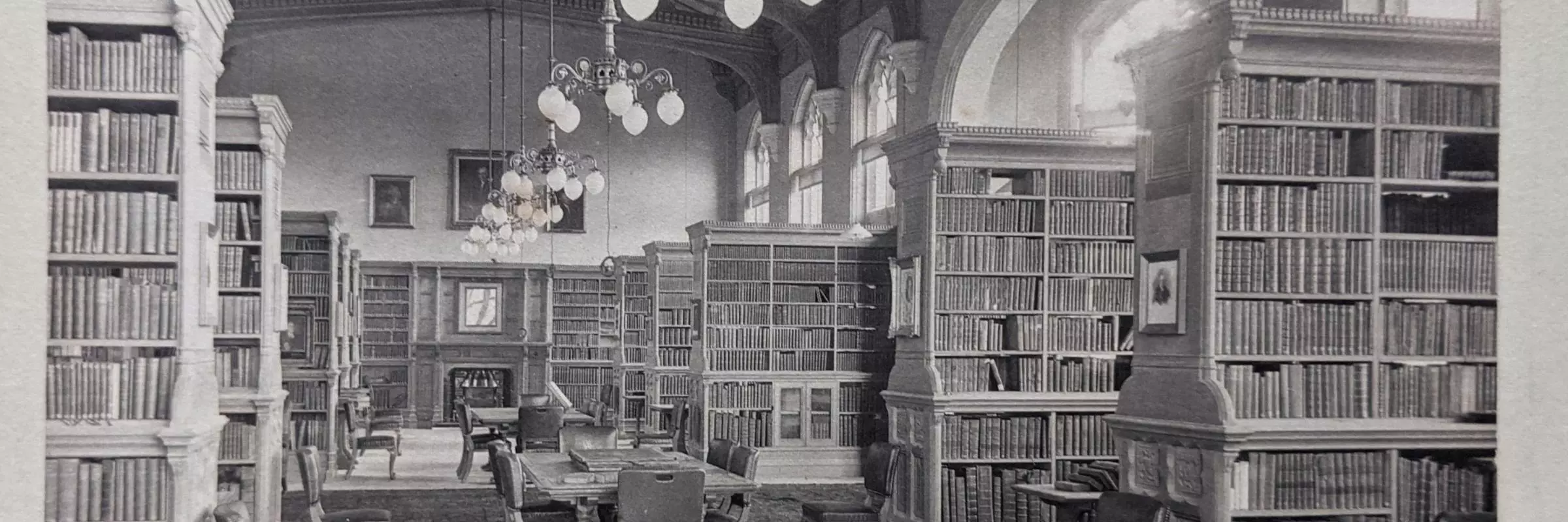 A long shot down the Library taken in the 1890s with furniture and bookcase in place