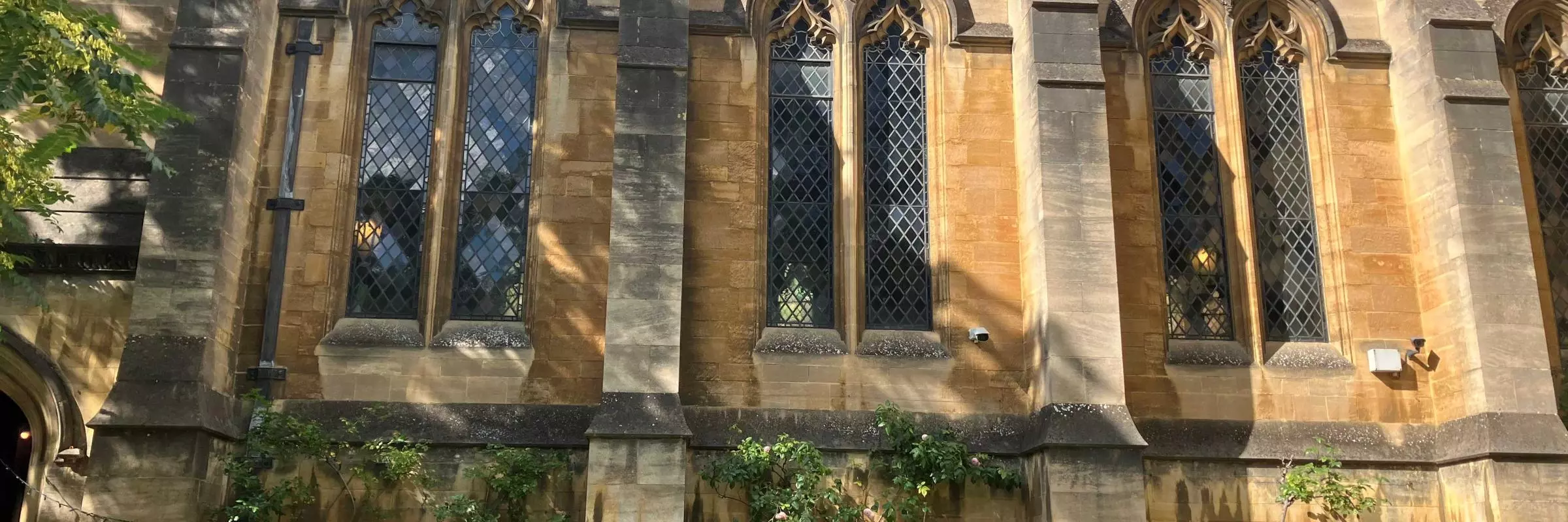 People walking past the Arlosh Hall