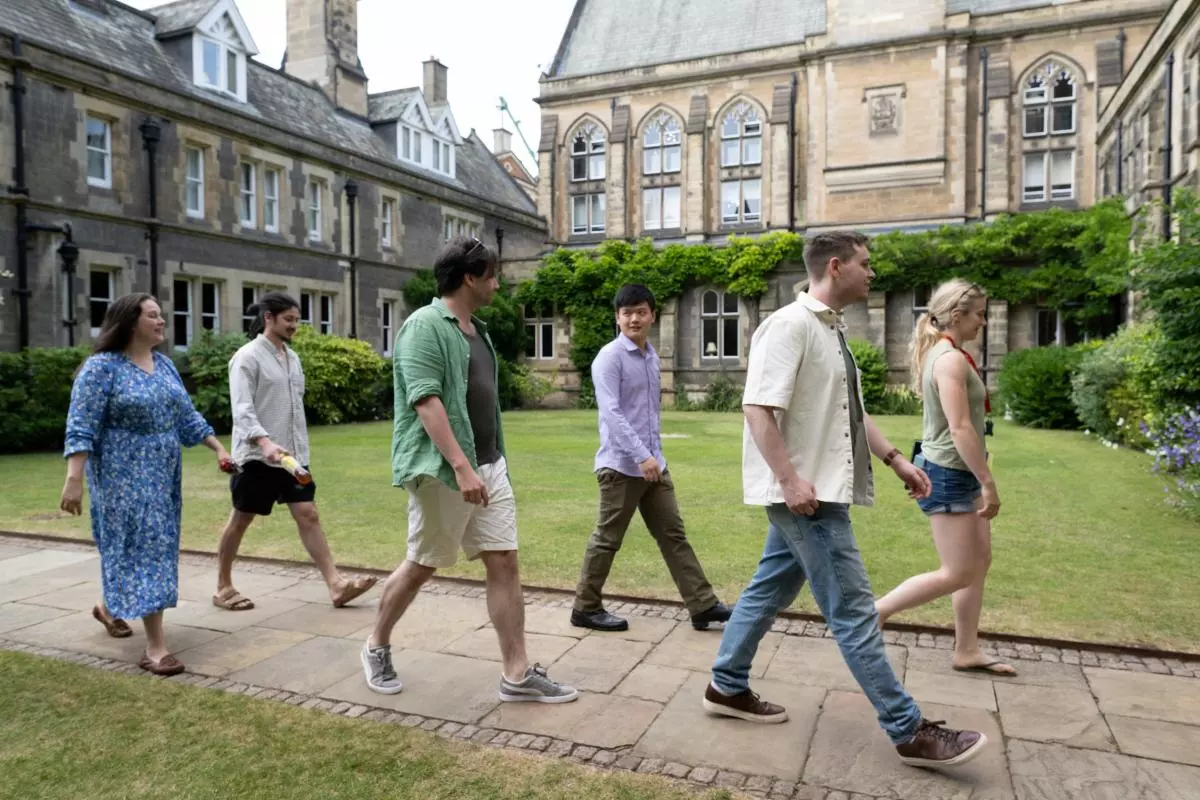 Students walking across an Oxford college quad